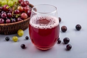 side-view-black-grape-juice-glass-with-grapes-basket-gray-background_141793-27306-300x200 How to make perfect grapes juice at home